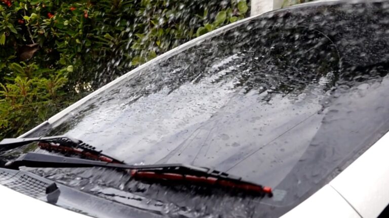Water cascading down a car windshield