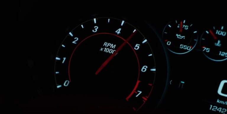 Close-up of a car's tachometer, displaying RPM