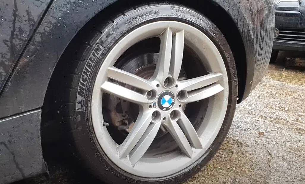 Close-up of a BMW run flat tire wheel being repaired