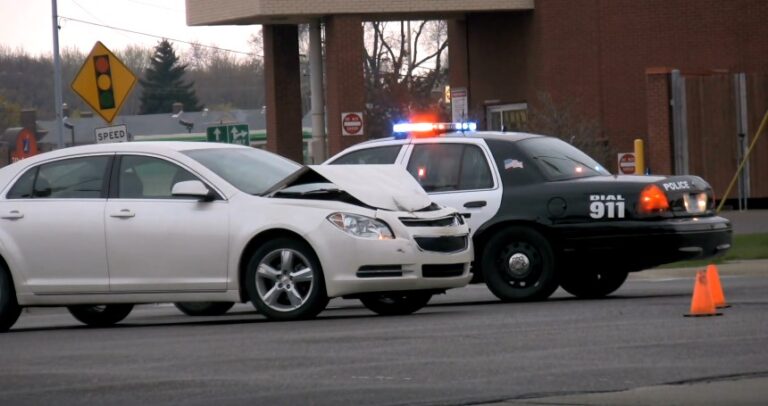Damaged vehicle and police presence at the scene of an accident