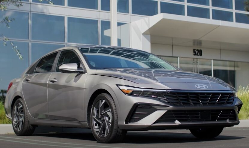 Hyundai Elantra sedan parked in front of the building