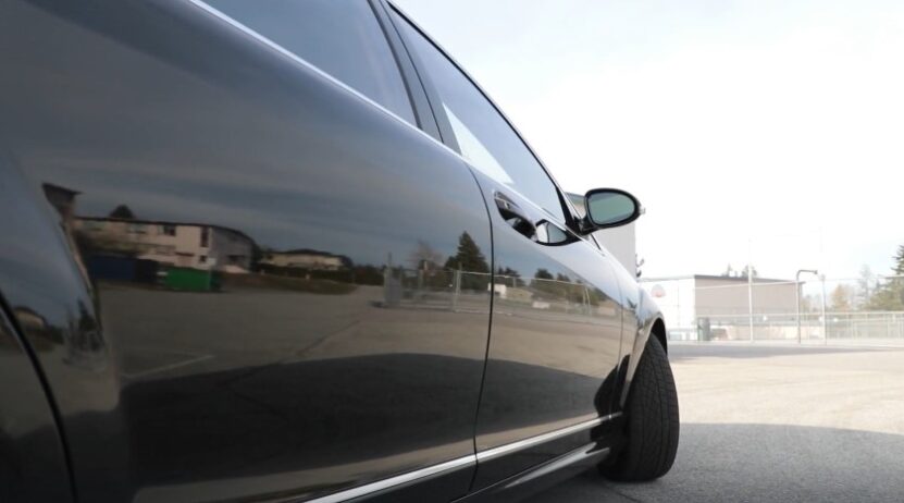 Close-up of a car's side, highlighting its polished exterior