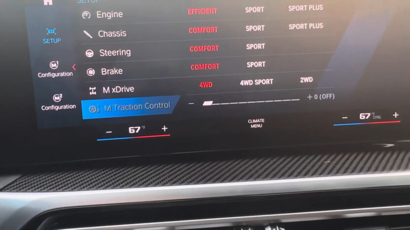 BMW vehicle touchscreen displaying M Setup menu with adjustable settings for engine, chassis, steering, brakes, xDrive, and traction control