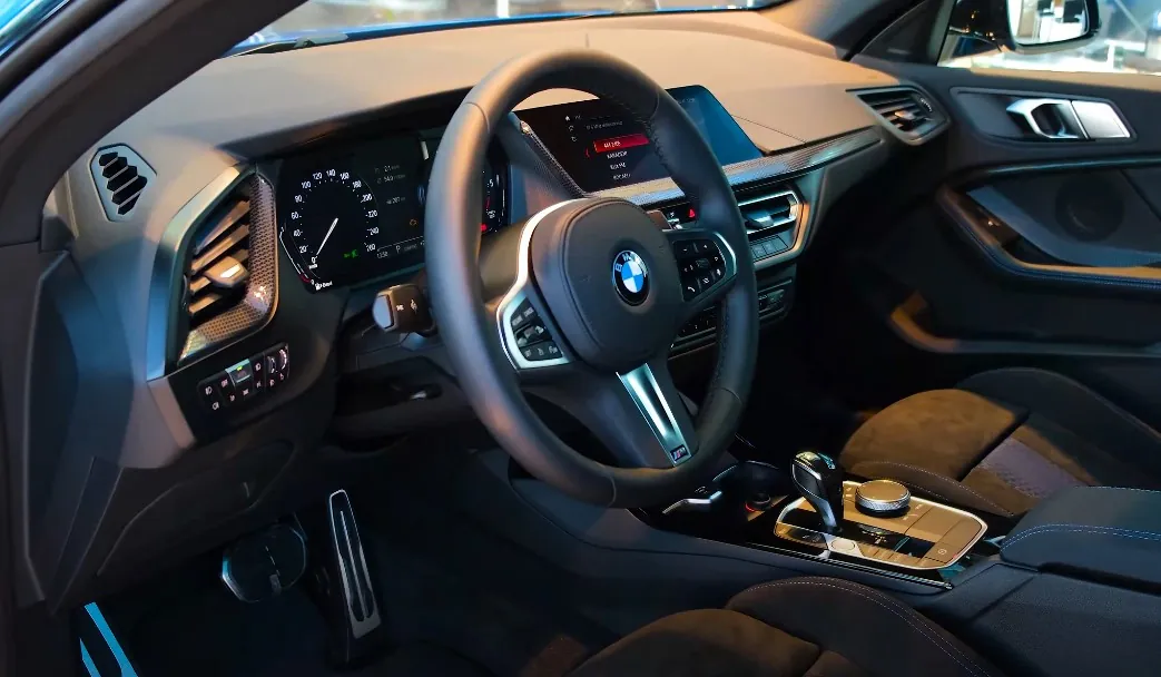 Interior view of a BMW, showing the dashboard, seats, and modern design elements