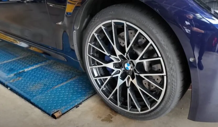 Detailed view of the wheel's spokes and the tire's tread pattern
