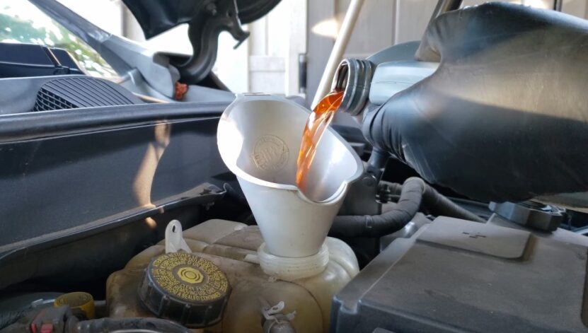 Engine oil being poured into the vehicle's engine