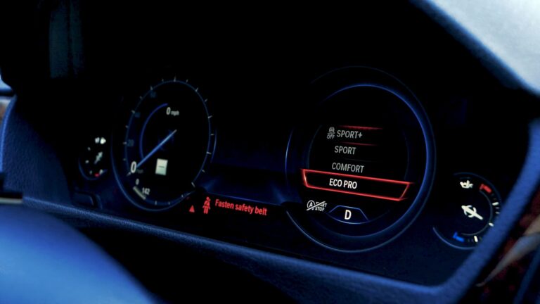 BMW digital instrument cluster displaying driving mode options: Sport+, Sport, Comfort, and Eco Pro with Eco Pro selected
