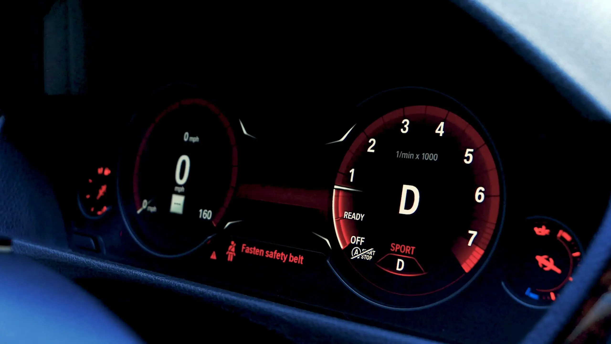 BMW dashboard in Sport+ driving mode showing tachometer, digital speedometer, and performance indicators