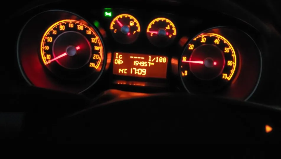 Dashboard illuminated with vibrant orange and red lights