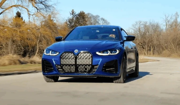 Close up view of a dark blue BMW M440i
