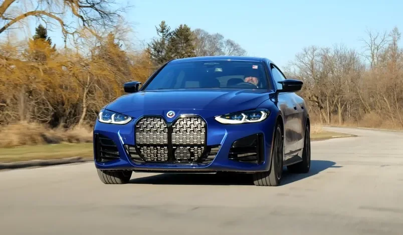 Close up view of a dark blue BMW M440i