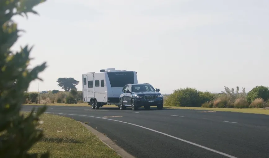 BMW X5 SUV pulling RV trailer