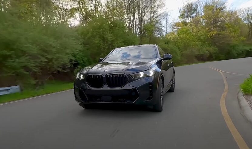 Black BMW X6 on a paved road