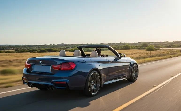 BMW convertible on a open road during hot summer day