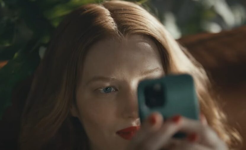 Close-up of a woman engrossed in her phone