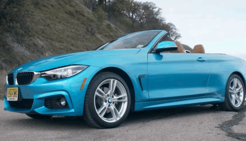 Vibrant teal convertible, showcasing sleek lines and a powerful presence