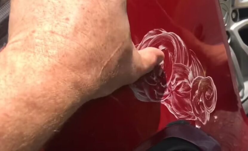 Applying a toothpaste to a car's scratch