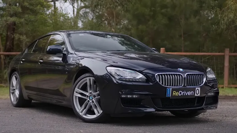 E63 BMW 6 Series parked on a road, linked to common mechanical problems and fixes