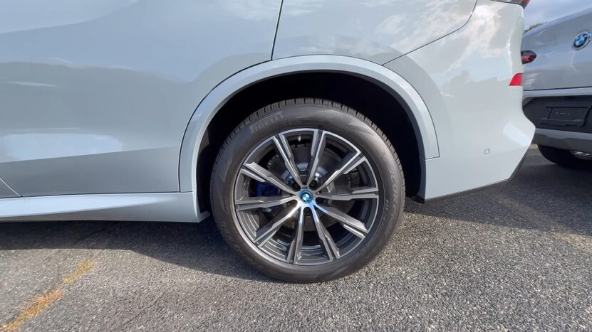 Close-up of a modern BMW SUV equipped with standard tires and factory alloy wheels