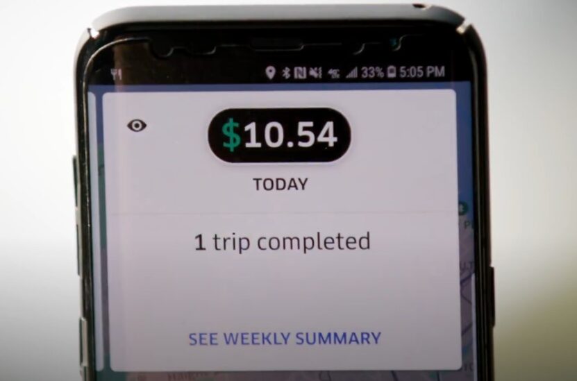 Ride-sharing app displays $10.54 earned today for one completed trip