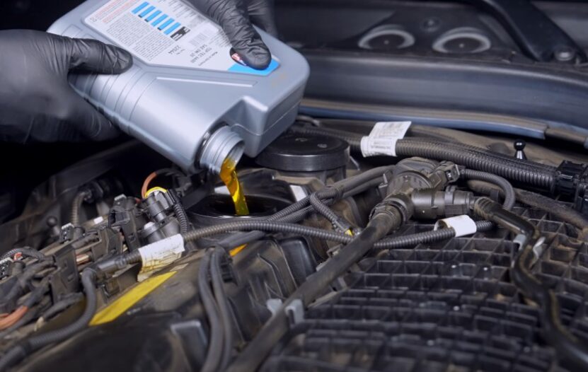 Engine oil being poured into the engine