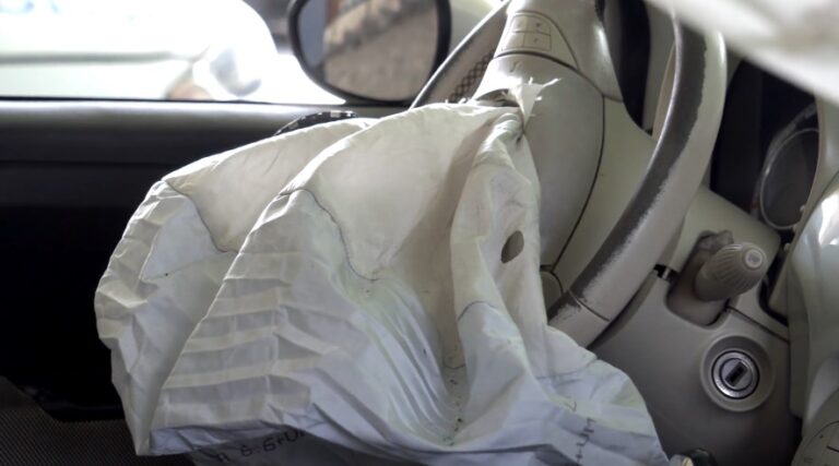 A deployed airbag, its fabric gently draped and gathered