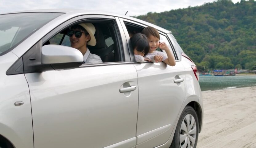 Family in a car on a road trip