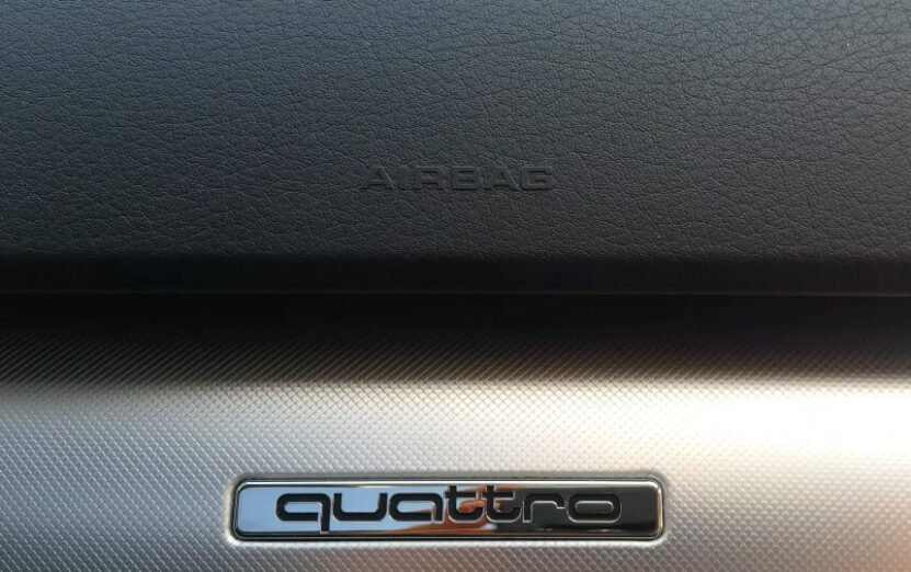 A close-up view of the airbag warning label on a car's dashboard