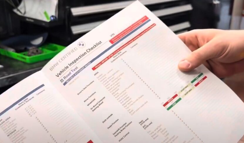 A person holding a checklist paper