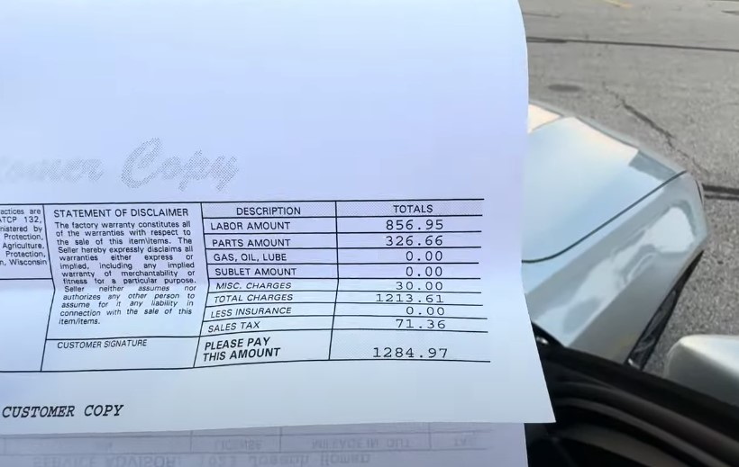 Detailed vehicle repair invoice, outlining labor, parts, and total costs