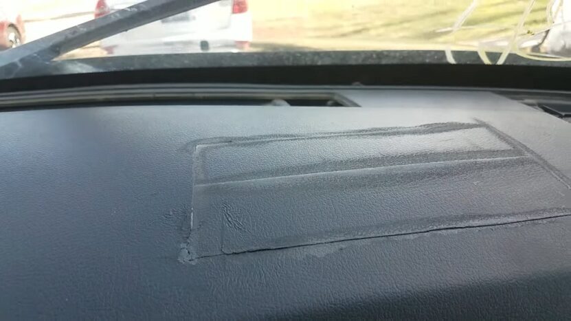 Car dashboard showing damage after airbag deployment