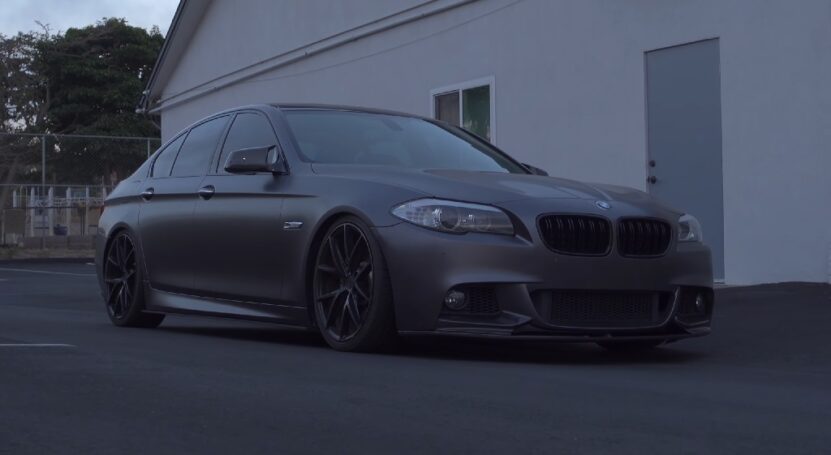BMW 5 Series F10 in matte grey finish, representing the older model in the F10 vs G30 comparison