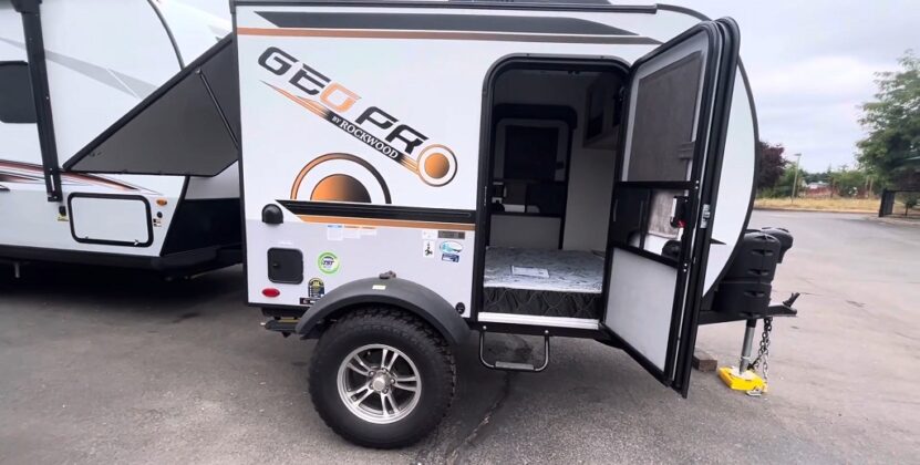 Forest River Geo Pro G12RK travel trailer with open door, showing a small bed inside