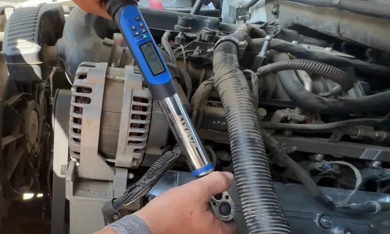 Mechanic checks oil consumption of a truck's engine