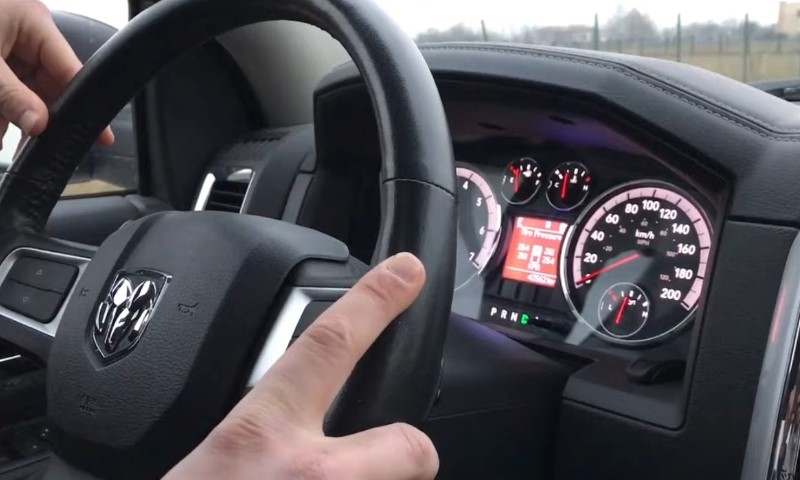 Close up view of a RAM 1500 steering wheel and dashboard