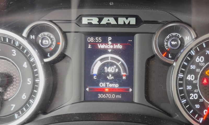 Close-up of a Ram truck dashboard displaying oil temperature at 140°F, time 08:55, with 30,670 miles on the odometer