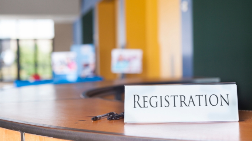 Registration sign on a counter inside a public office building