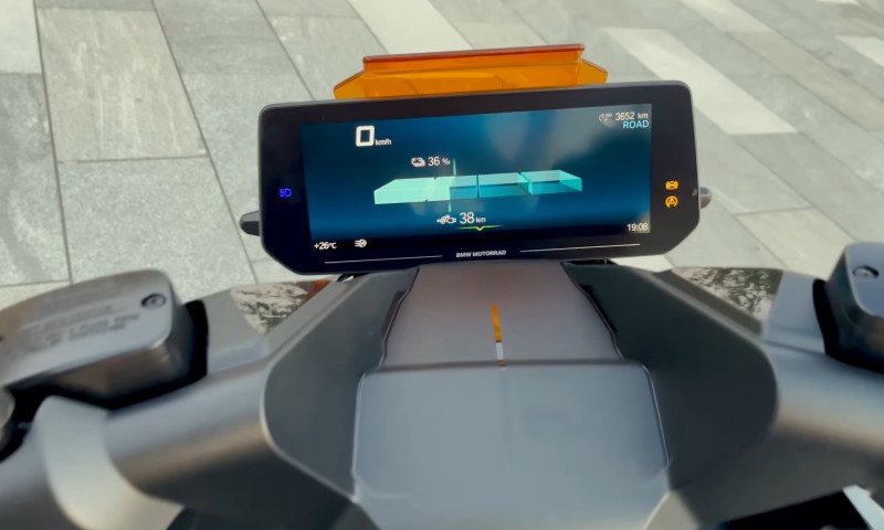Close-up of a BMW Motorrad digital dashboard, displaying speed, battery level, and mode